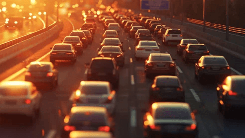Heavy traffic congestion on a highway during golden hour